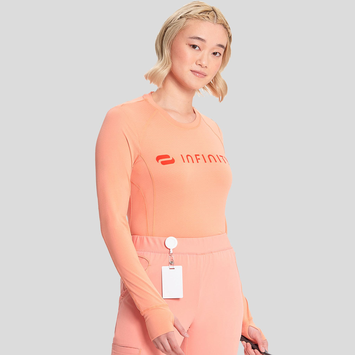 IN_INFINITY_GNR8_LOGOPERFORMANCEUNDERSCRUB_641_ELECTRICCORAL_RIGHT
